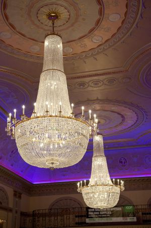 Chandeliers lit up at a gala dinner at Plaisterers Hall, London